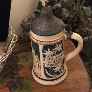 From Germany…. Beautiful antique beer stein with pewter lid.